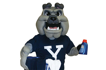 An illustration of Yale's bulldog mascot holding a laundry basket